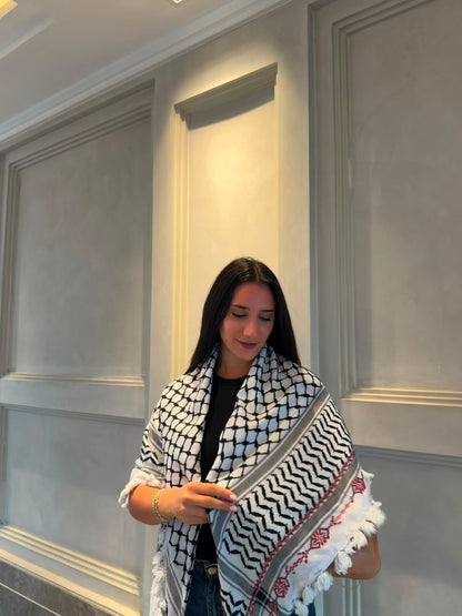 A hand-made embroidered Palestinian keffiyeh-shawl
