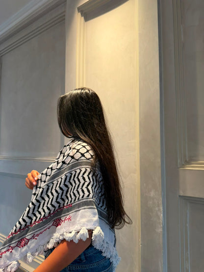 A hand-made embroidered Palestinian keffiyeh-shawl