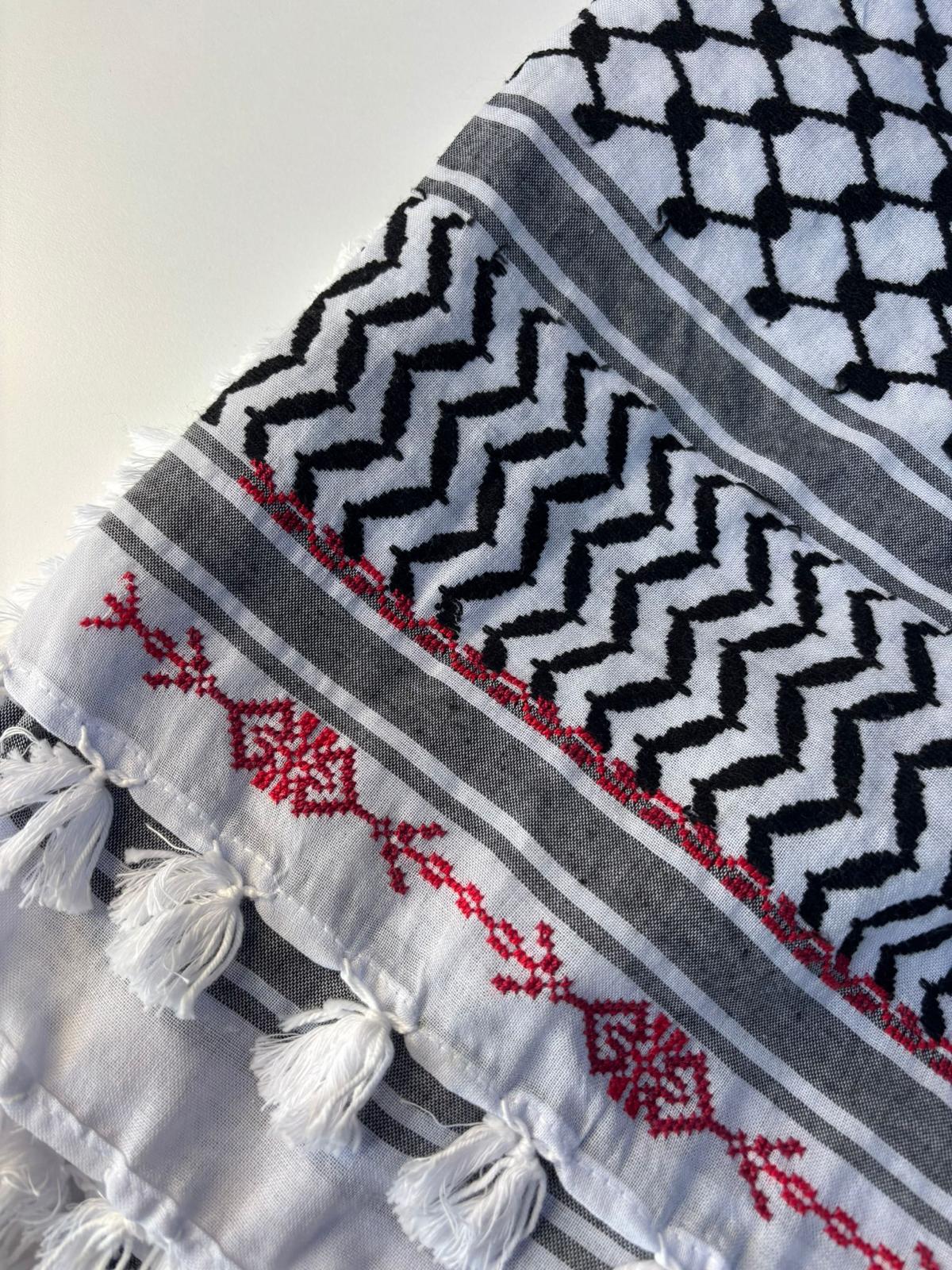 A hand-made embroidered Palestinian keffiyeh-shawl