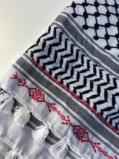 A hand-made embroidered Palestinian keffiyeh-shawl